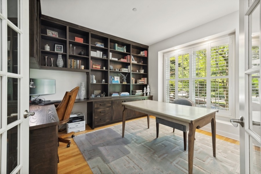 1918 Lynn Circle Libertyville, IL 60048 - Photo 5 of 17 a view of a workspace with furniture and a bookshelf