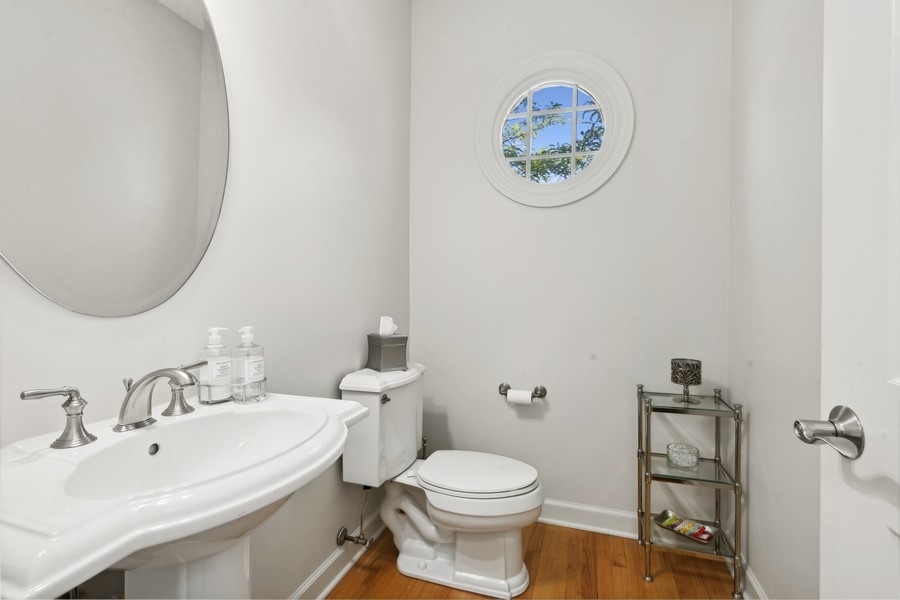 1918 Lynn Circle Libertyville, IL 60048 - Photo 7 of 17 a bathroom with a sink and a toilet