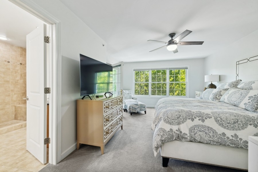 1918 Lynn Circle Libertyville, IL 60048 - Photo 8 of 17 a living room with a bed furniture and a large window