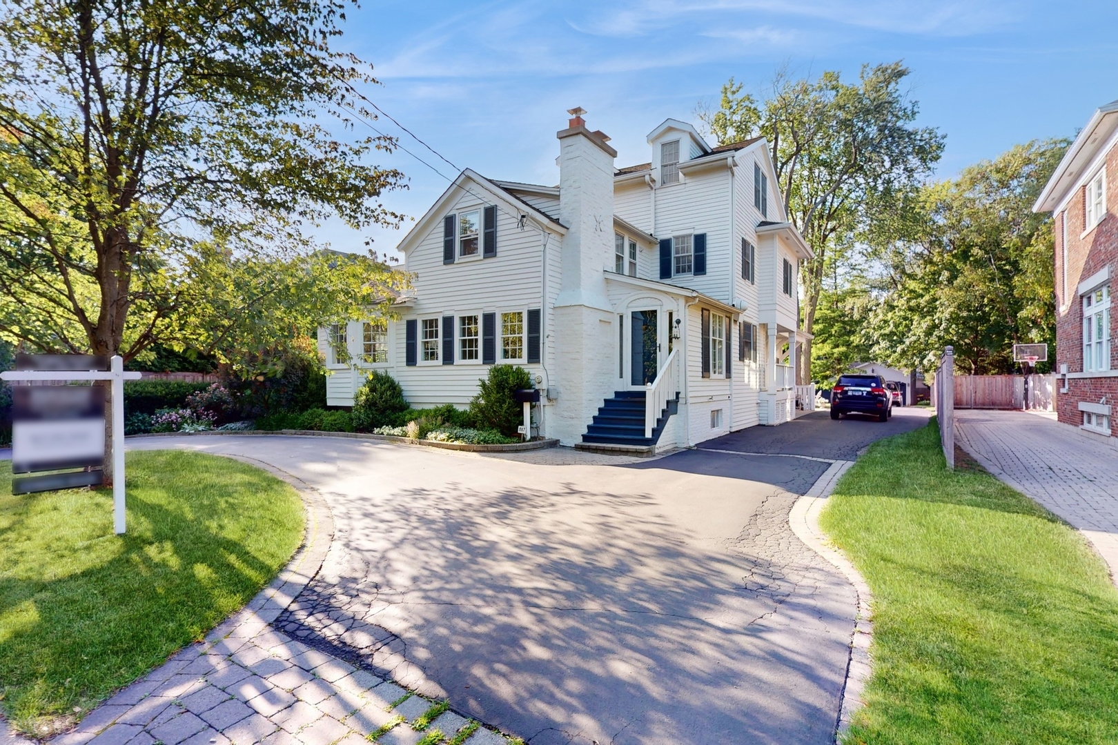 687 Hill Road Winnetka, IL 60093 - Photo 2 of 54 a view of a house with a garden