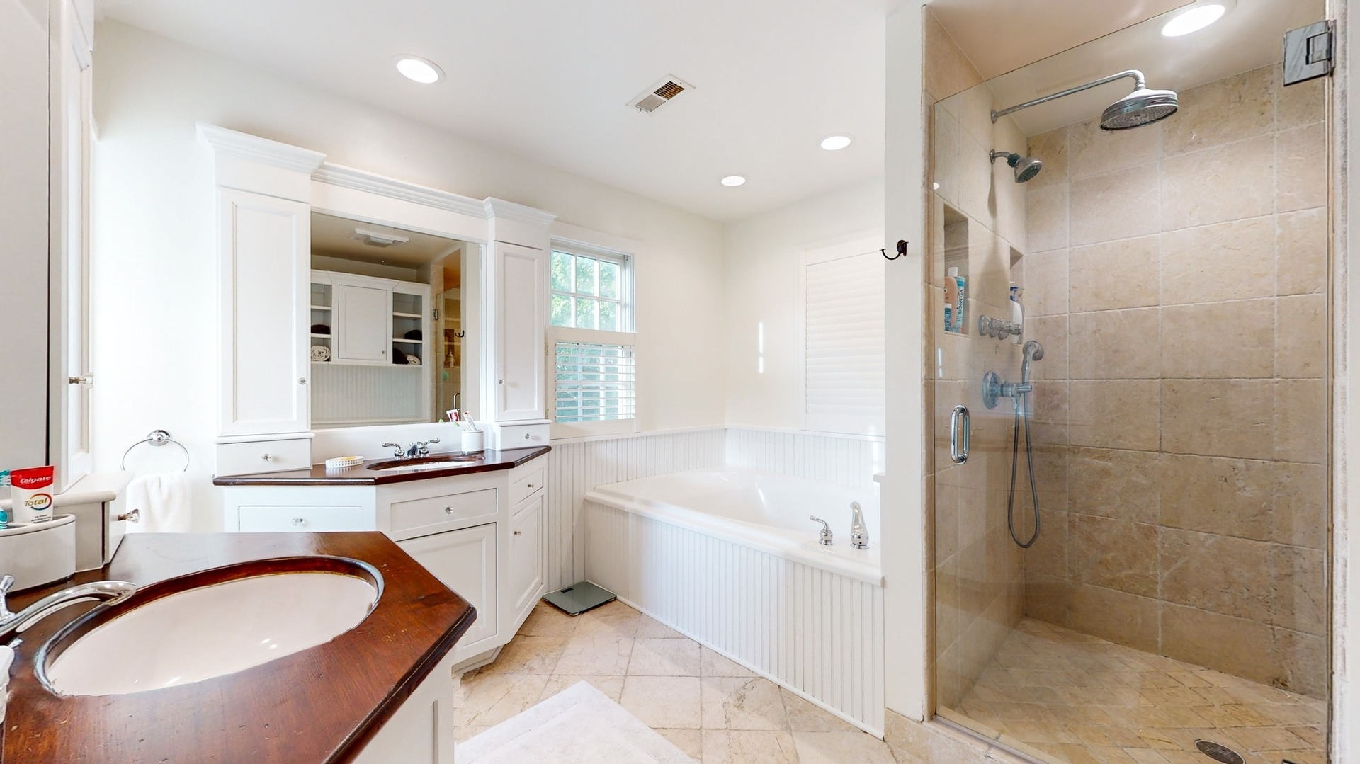 687 Hill Road Winnetka, IL 60093 - Photo 25 of 54 a bathroom with a granite countertop sink mirror bathtub and shower