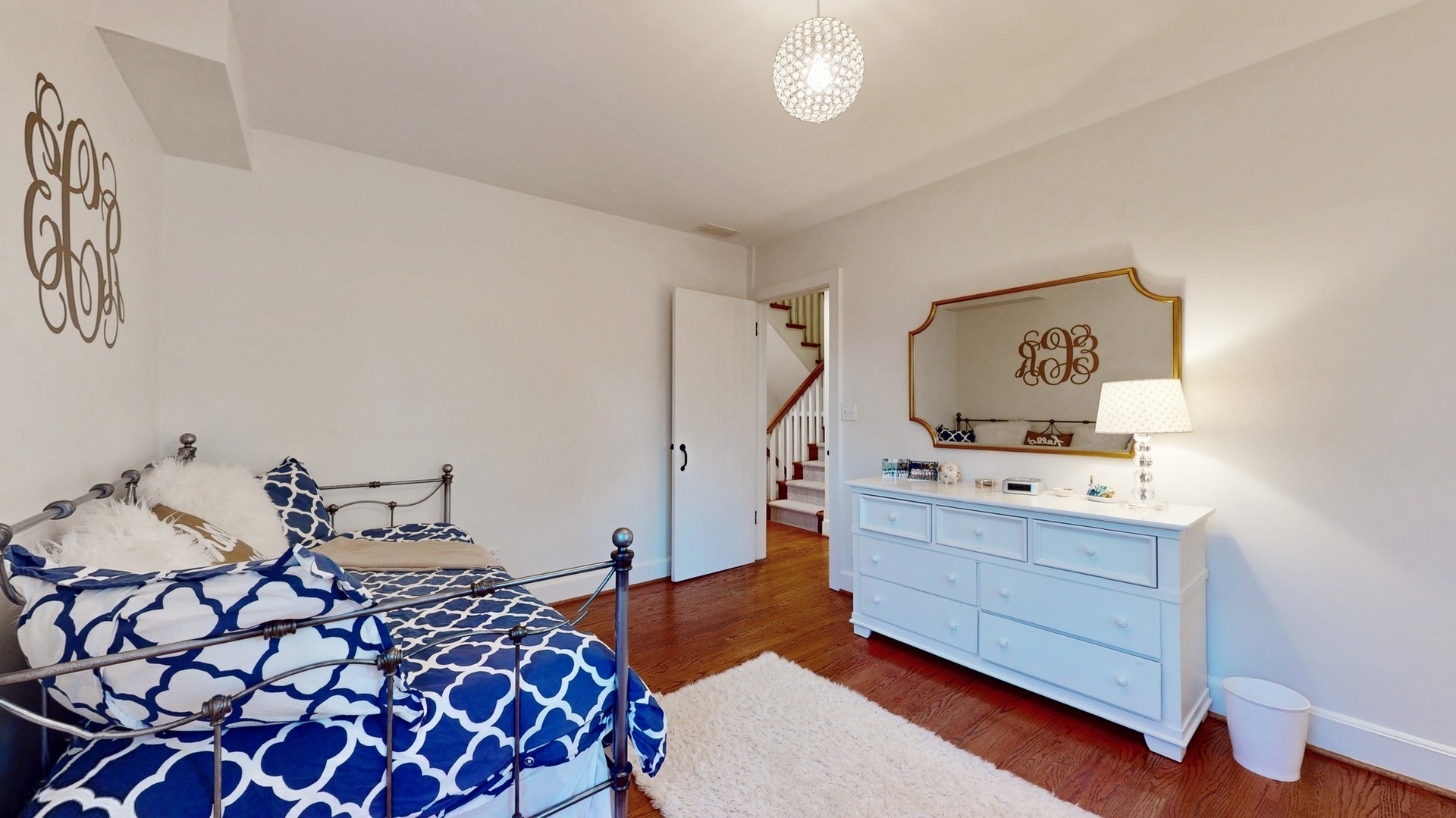 687 Hill Road Winnetka, IL 60093 - Photo 30 of 54 a bedroom with a bed and wooden floor