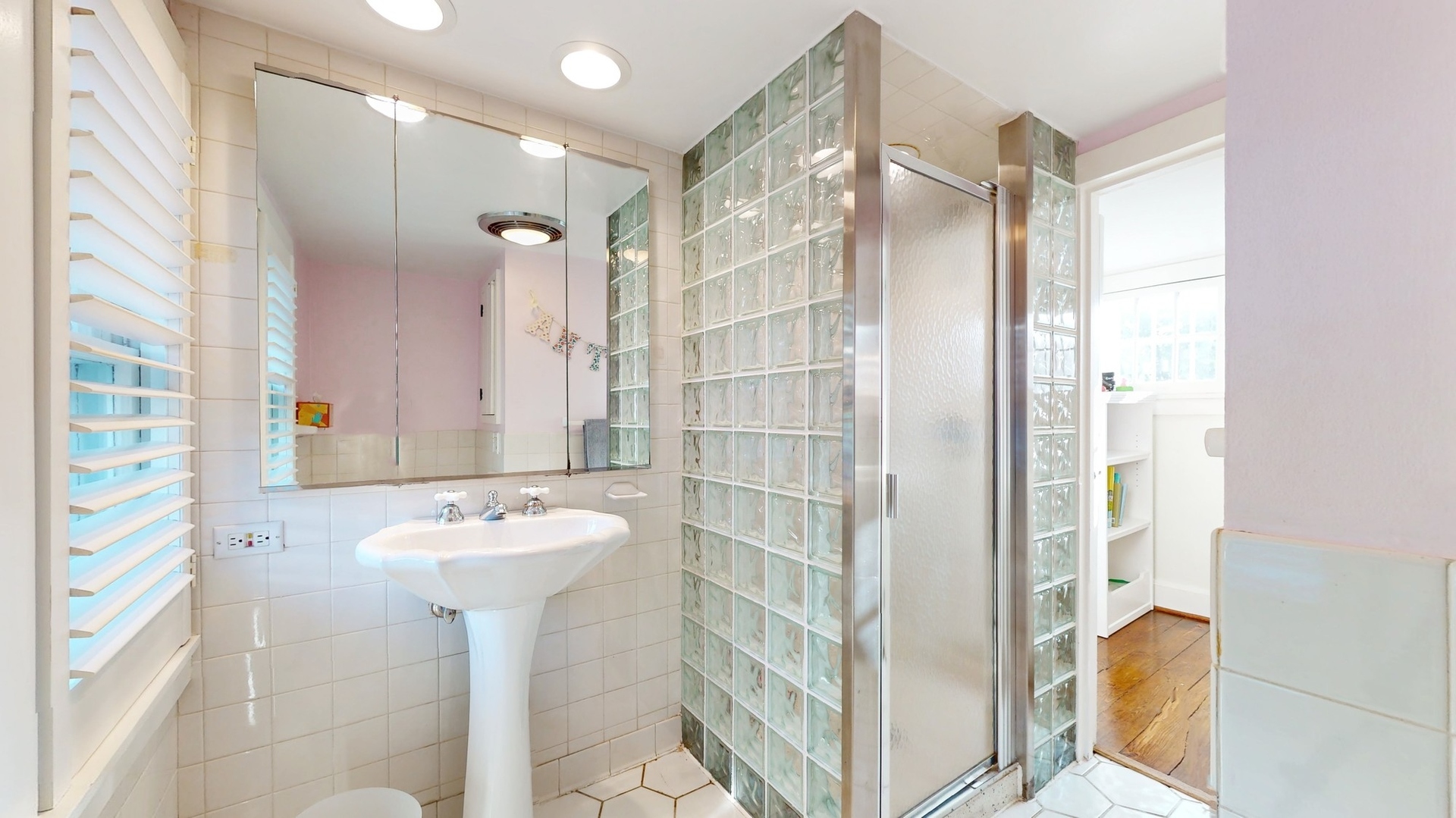 687 Hill Road Winnetka, IL 60093 - Photo 36 of 54 a bathroom with a sink and a mirror