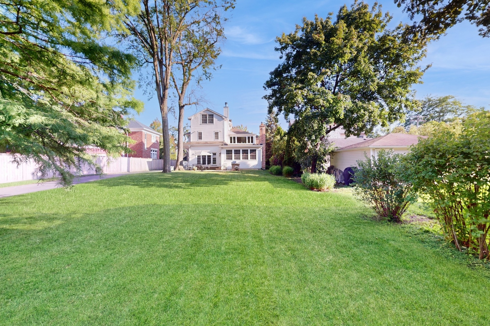 687 Hill Road Winnetka, IL 60093 - Photo 45 of 54 a view of a house with a yard