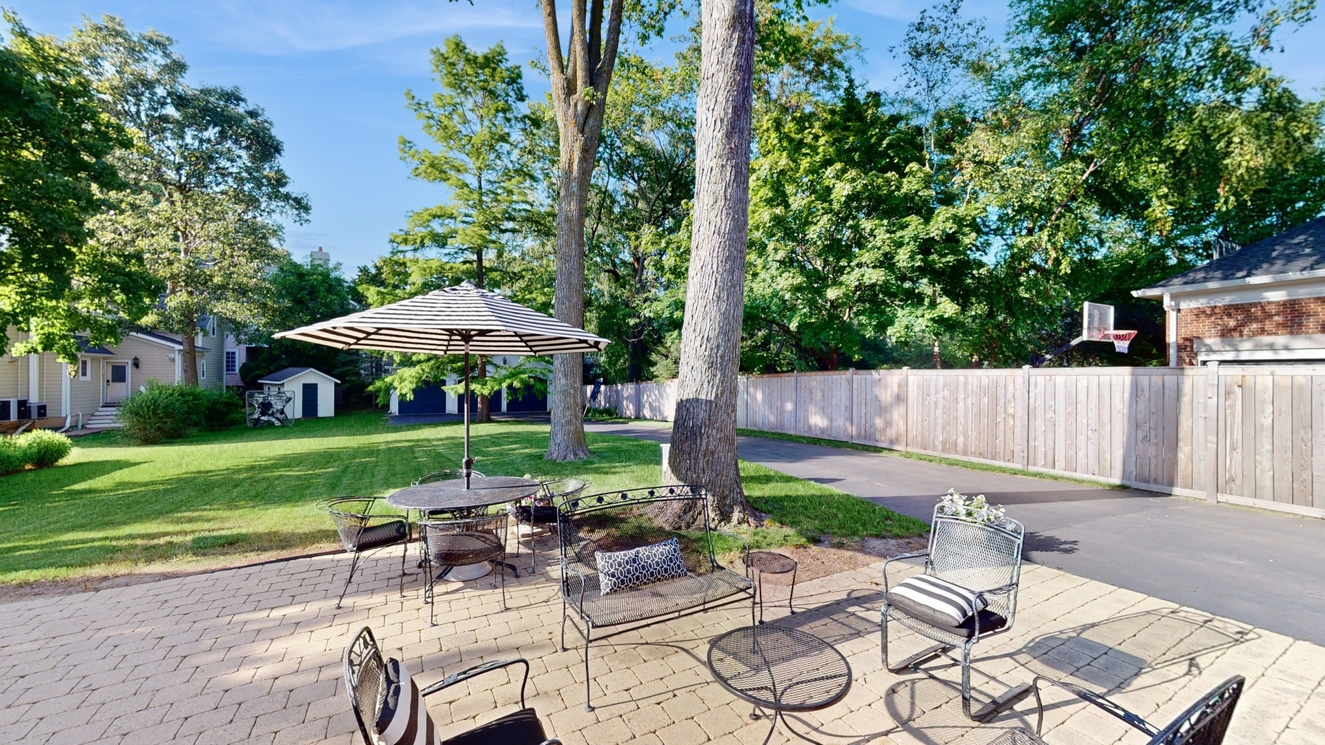 687 Hill Road Winnetka, IL 60093 - Photo 49 of 54 a view of a table and chairs under an umbrella