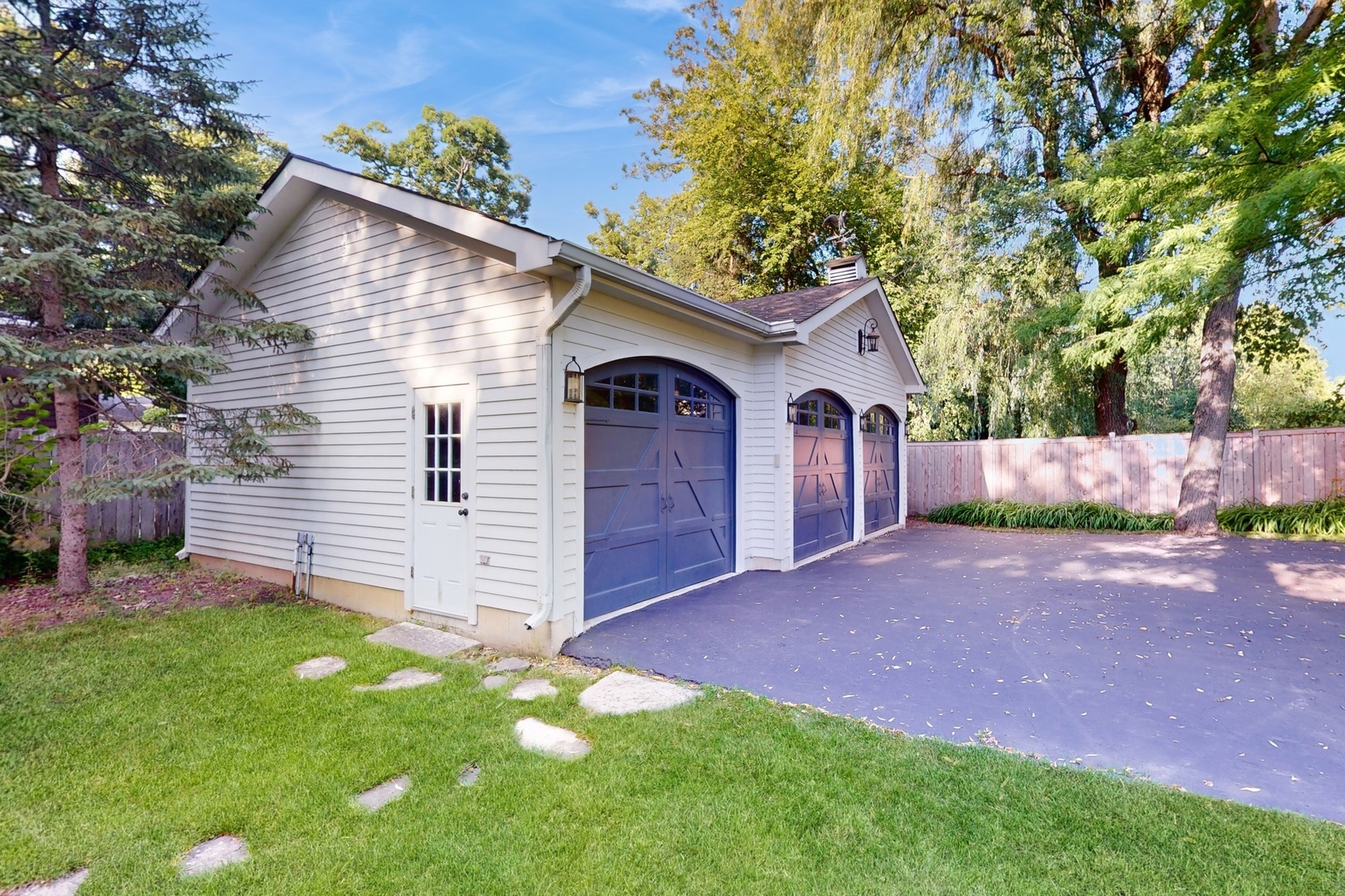 687 Hill Road Winnetka, IL 60093 - Photo 50 of 54 a front view of a house with a yard and garage