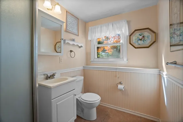 a bathroom with a toilet and a sink