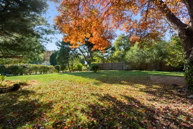 a view of a field with sitting area