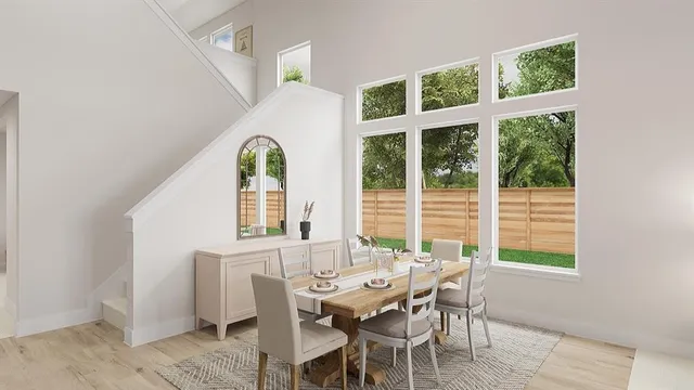 a view of a dining room with furniture window and outside view