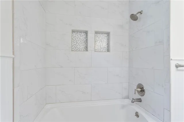 a bathroom with a sink and shower