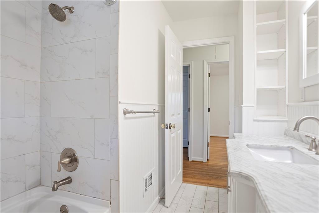 4433 Locksley Road Tucker, GA 30084 - Photo 19 of 33 a bathroom with a sink and shower