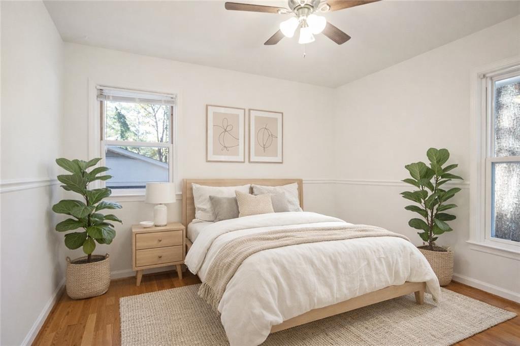 4433 Locksley Road Tucker, GA 30084 - Photo 20 of 33 a bedroom with a bed and a potted plant