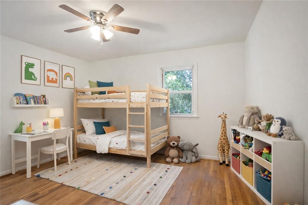4433 Locksley Road Tucker, GA 30084 - Photo 23 of 33 a bedroom with furniture and a book shelf