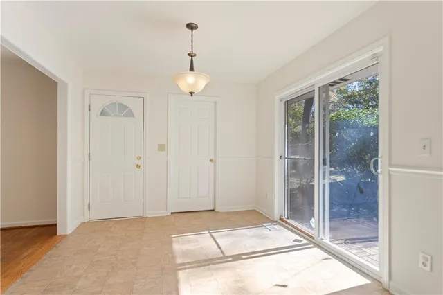 a view of an empty room and window