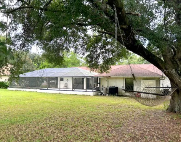 a front view of a house with a yard table and chairs