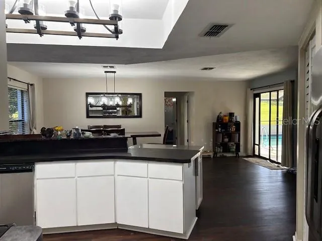 a kitchen with a sink stainless steel appliances and cabinets
