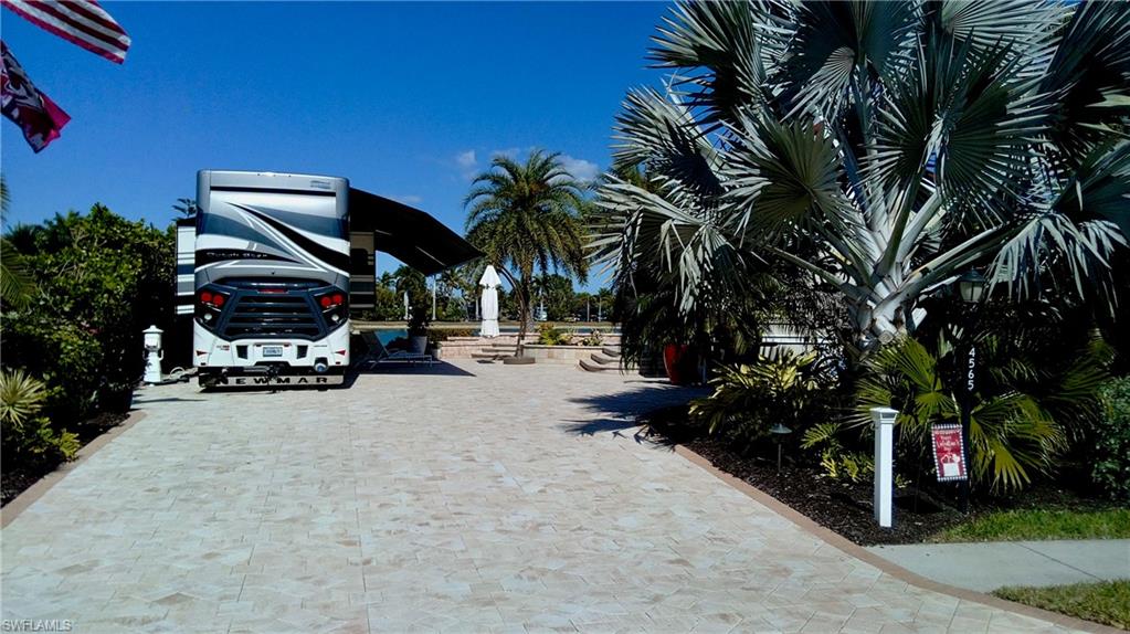 4565 Southern Breeze Drive Naples, FL 34114 - Photo 2 of 19 View of decorative driveway