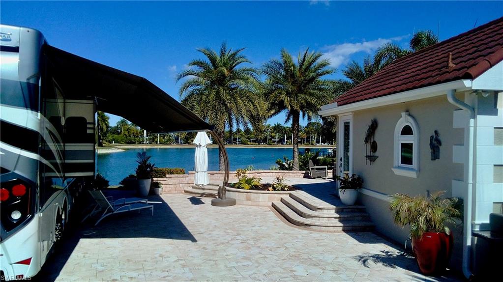 4565 Southern Breeze Drive Naples, FL 34114 - Photo 3 of 19 View of patio featuring a water view