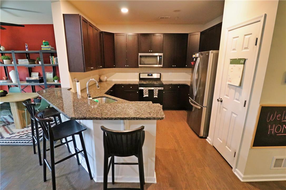4502 Benjamin Court Emmaus, PA 18049 - Photo 9 of 53 Granite counters and stainless steel appliances adorn this well-appointed kitchen.