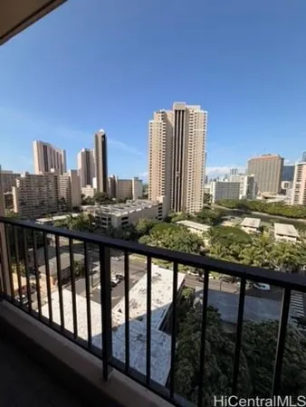 a view of a balcony with city