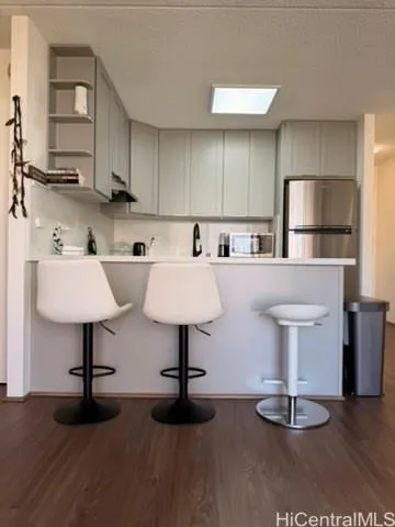 a kitchen with cabinets a sink and appliances