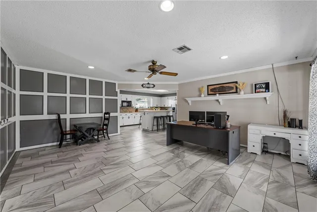 a view of a livingroom with furniture and a window