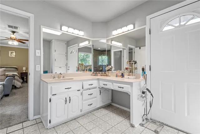 a bathroom with a glass door shower