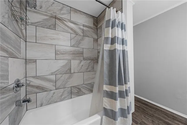 a bathroom with a granite countertop sink a toilet and a mirror