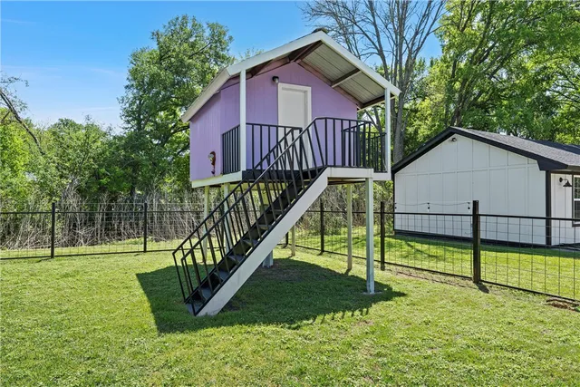 a view of a park with large trees