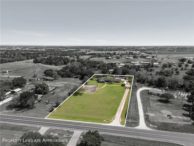 an aerial view of residential building and lake