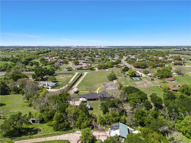 a view of a swimming pool and an outdoor seating