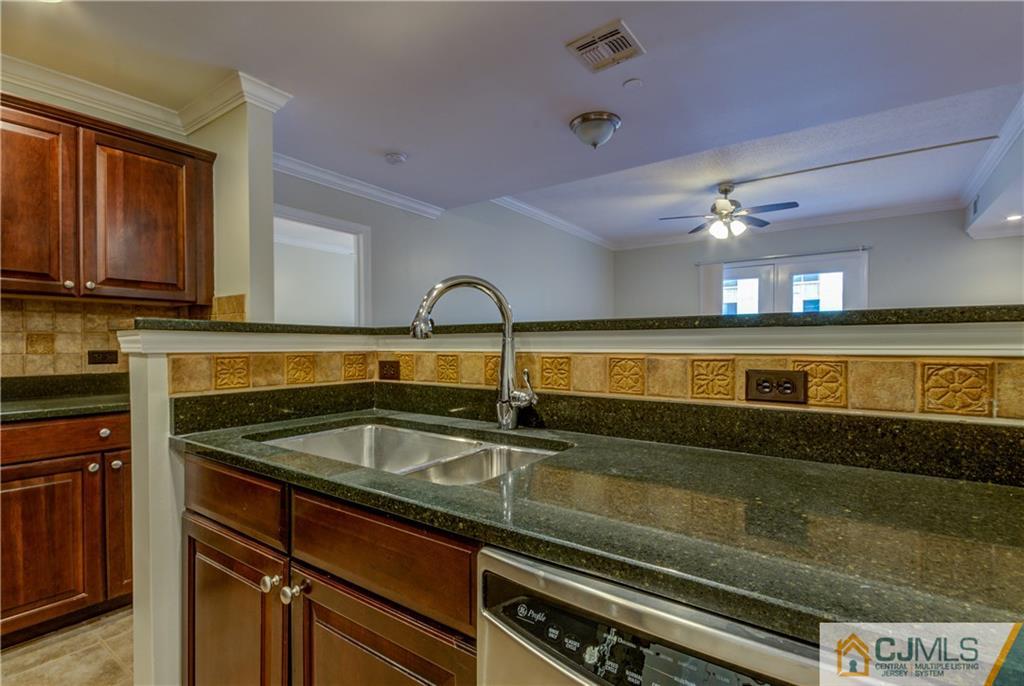 358 Rector Street, Unit 607 Perth Amboy, NJ 08861 - Photo 12 of 25 a kitchen with a sink and cabinets