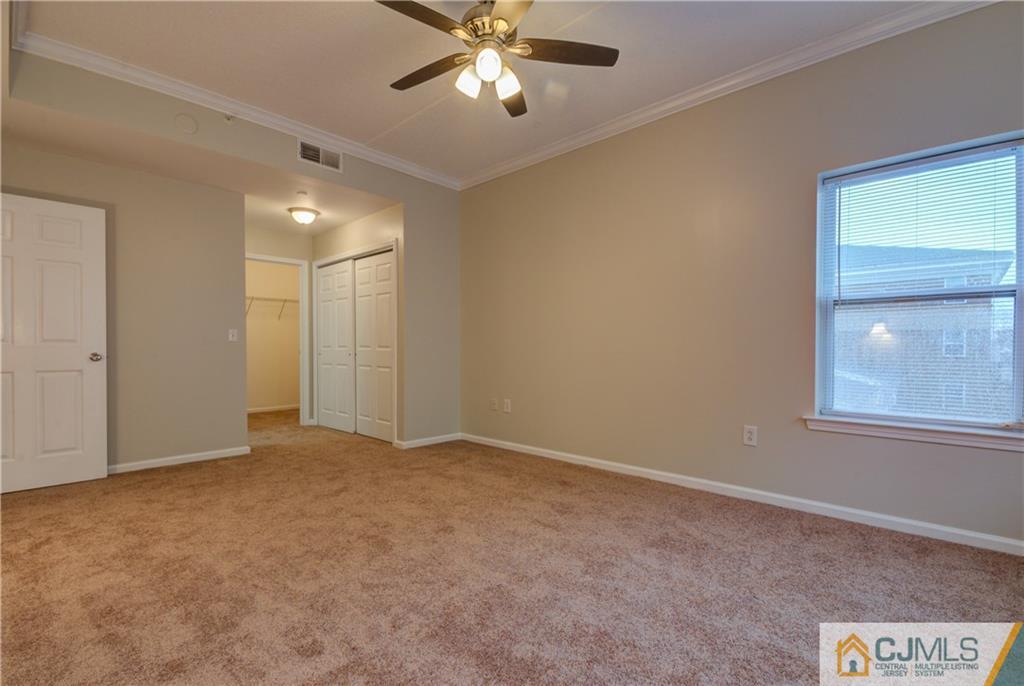 358 Rector Street, Unit 607 Perth Amboy, NJ 08861 - Photo 20 of 25 an empty room with windows and fan