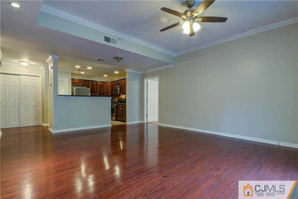 358 Rector Street, Unit 607 Perth Amboy, NJ 08861 - Photo 8 of 25 a view of an empty room with a window and wooden floor