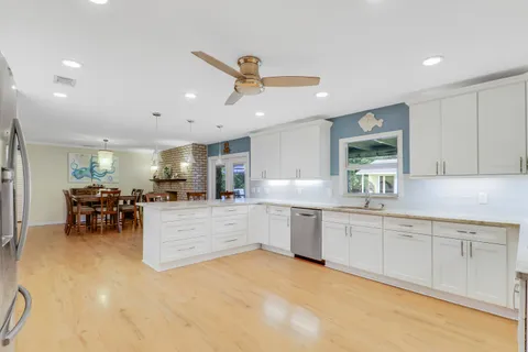 a kitchen with sink and microwave
