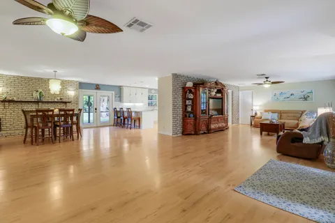 a living room with furniture and kitchen view