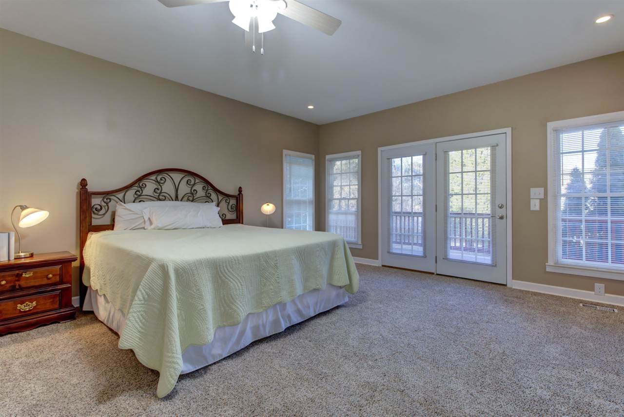 7220 Ridgeline Drive Raleigh, NC 27613 - Photo 5 of 16 In-Law suite or first floor master -you choose. There's tons of privacy, a laundry room and lots of closet and storage space. You can also access the screen porch and deck which overlooks the private yard. 1st Floor Master Suite