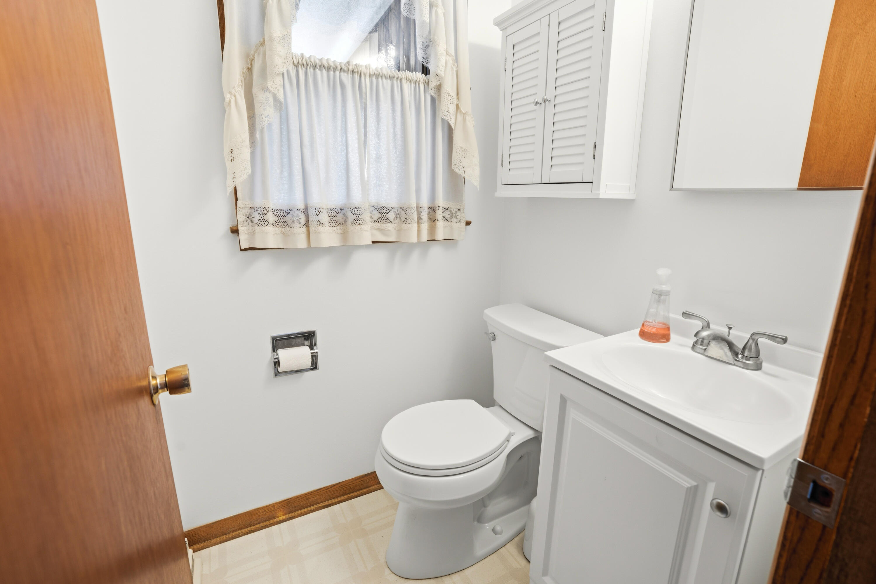 4133 Lexington Avenue Caledonia, WI 53404 - Photo 14 of 42 Half bath (main level) with new vanity, mirror, cabinets