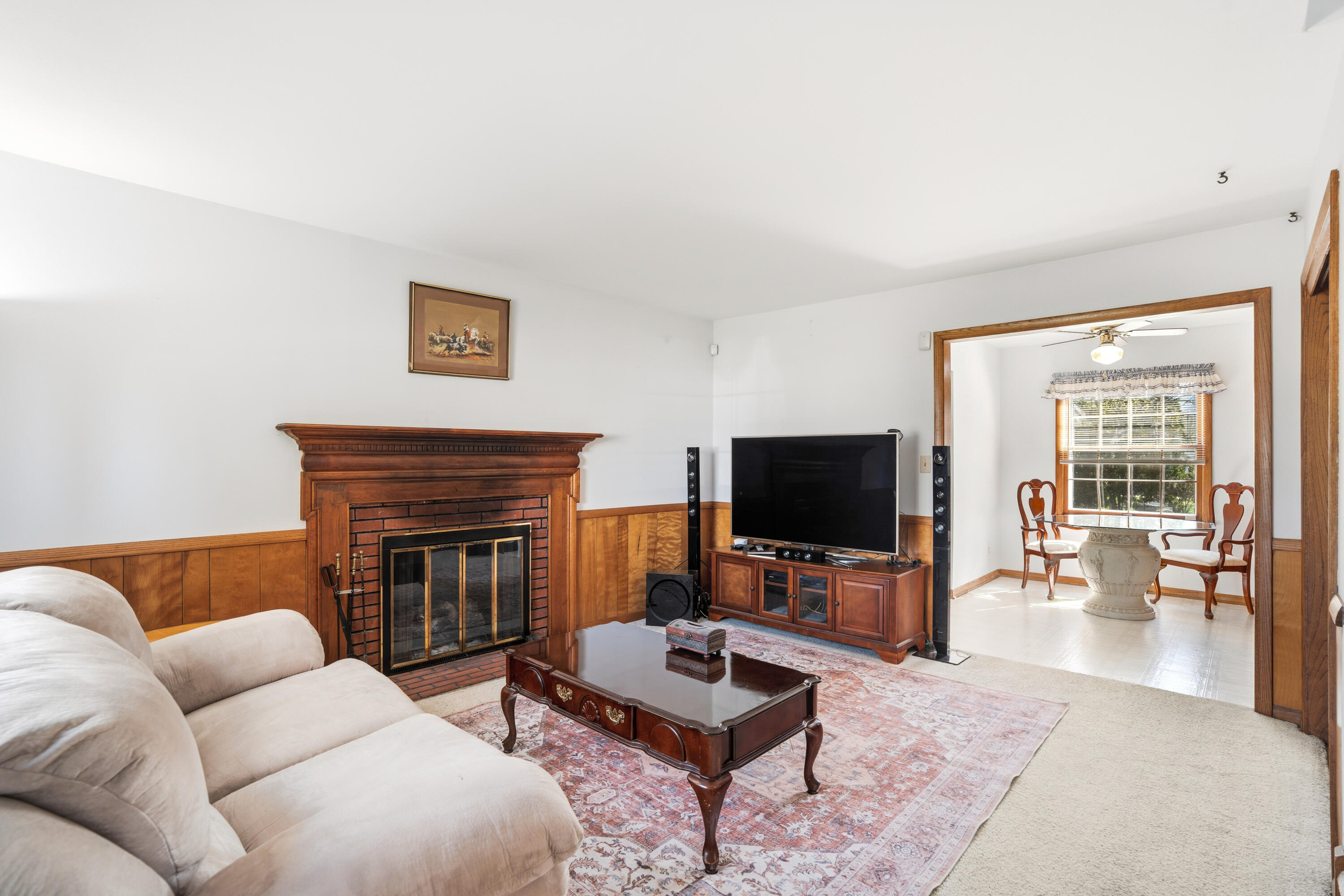 4133 Lexington Avenue Caledonia, WI 53404 - Photo 2 of 42 Den with fireplace - small rust stain under area rug