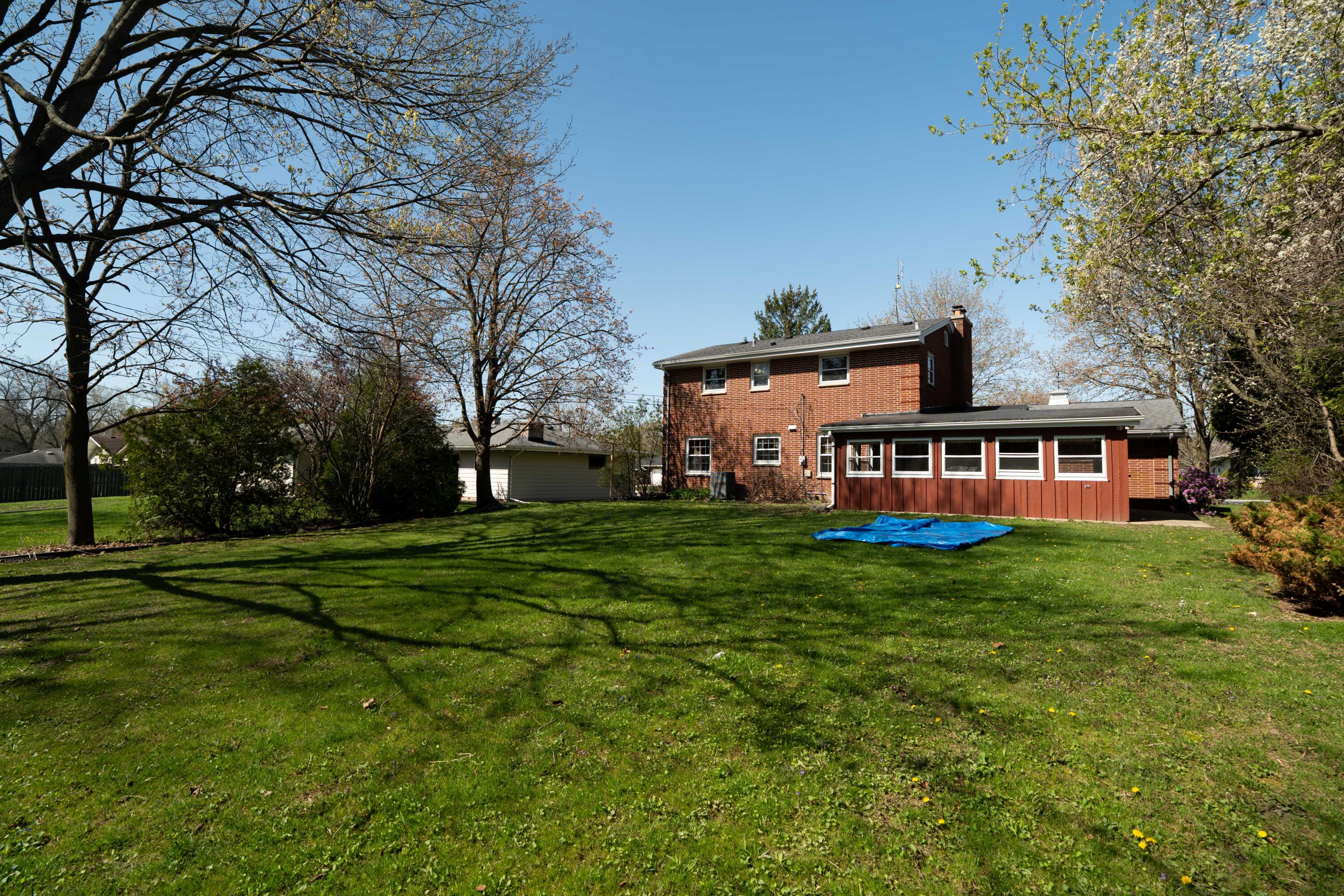 4133 Lexington Avenue Caledonia, WI 53404 - Photo 37 of 42 Rear yard with 3 season room