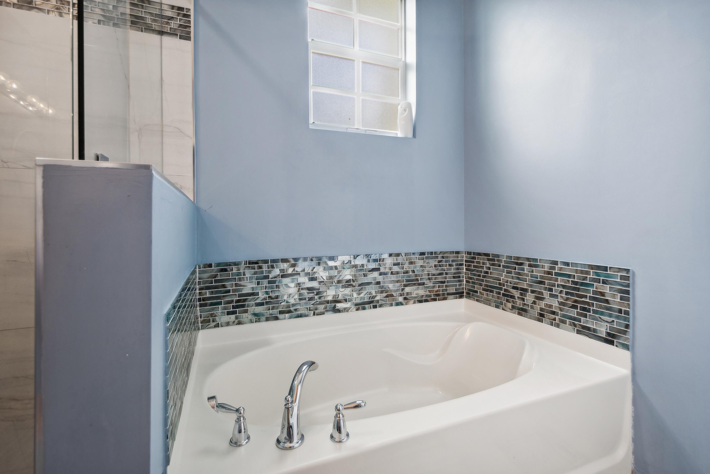 148 Southwest 7th Court Pompano Beach, FL 33060 - Photo 11 of 19 a bathroom with a bathtub