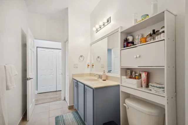 a room with a sink and a mirror