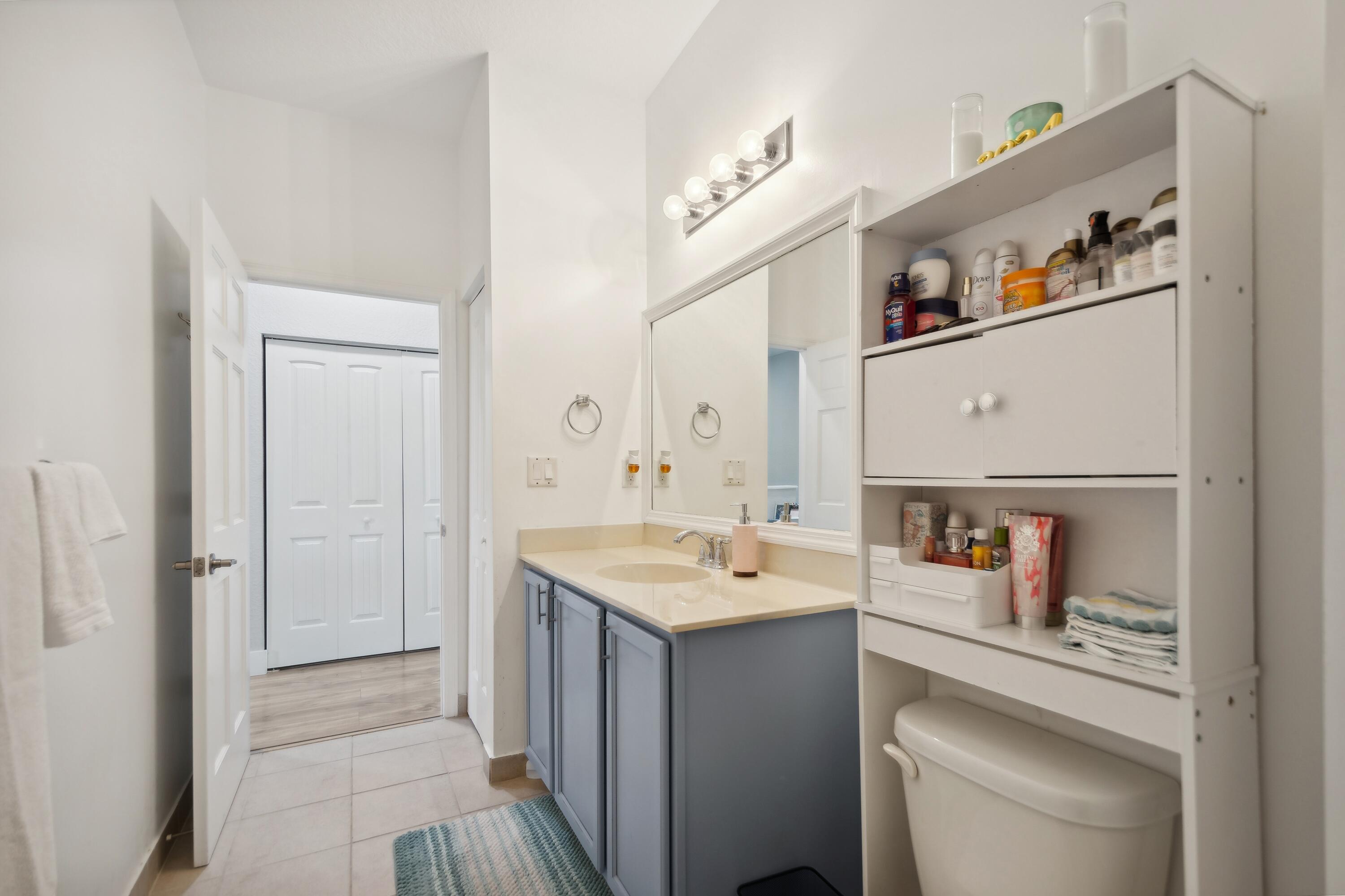 148 Southwest 7th Court Pompano Beach, FL 33060 - Photo 13 of 19 a room with a sink and a mirror