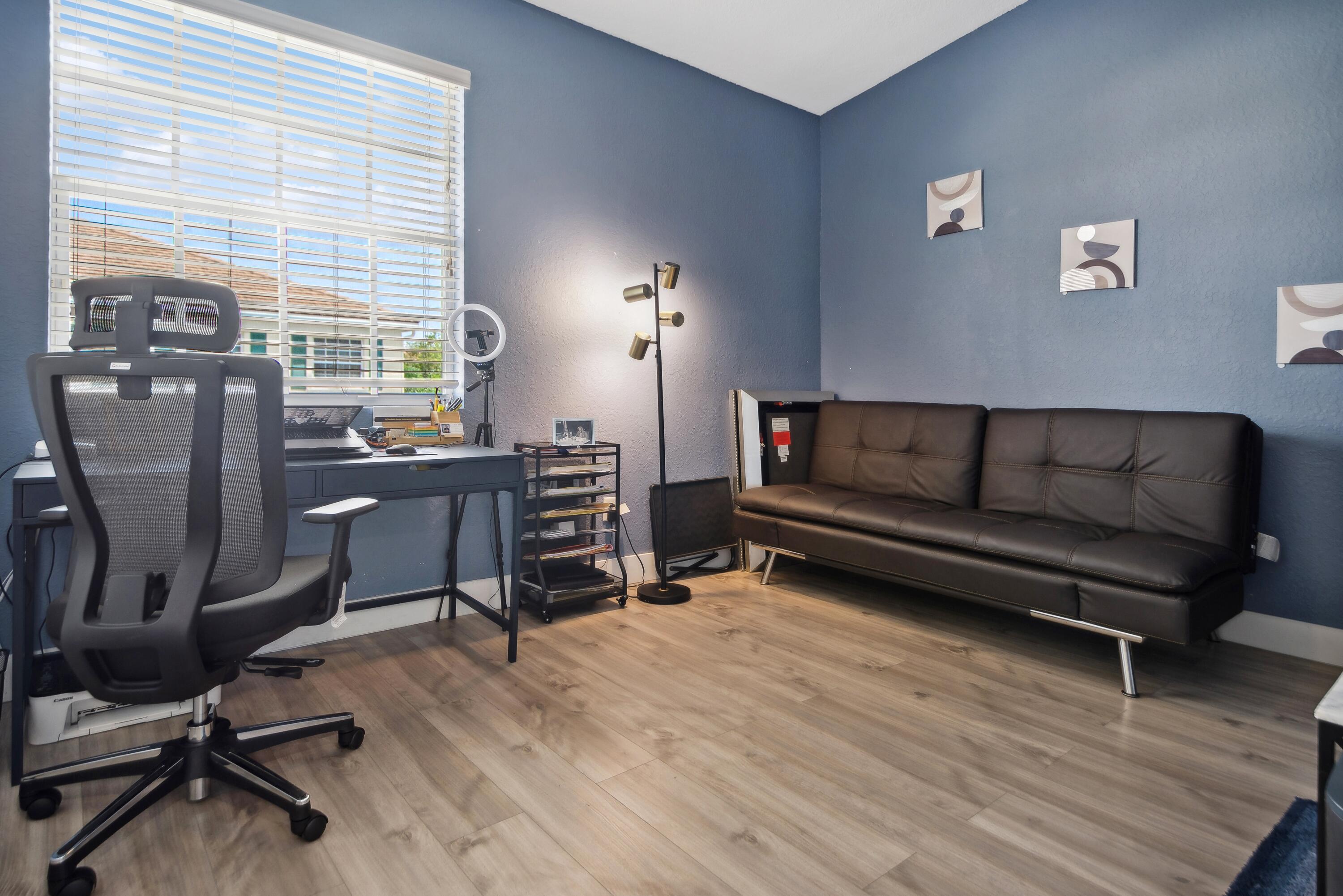 148 Southwest 7th Court Pompano Beach, FL 33060 - Photo 14 of 19 a view of a workspace with furniture and a window