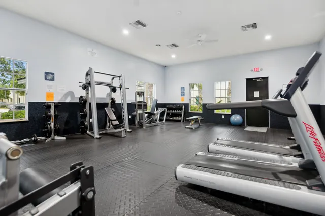 a living room with lots of furniture and a rug