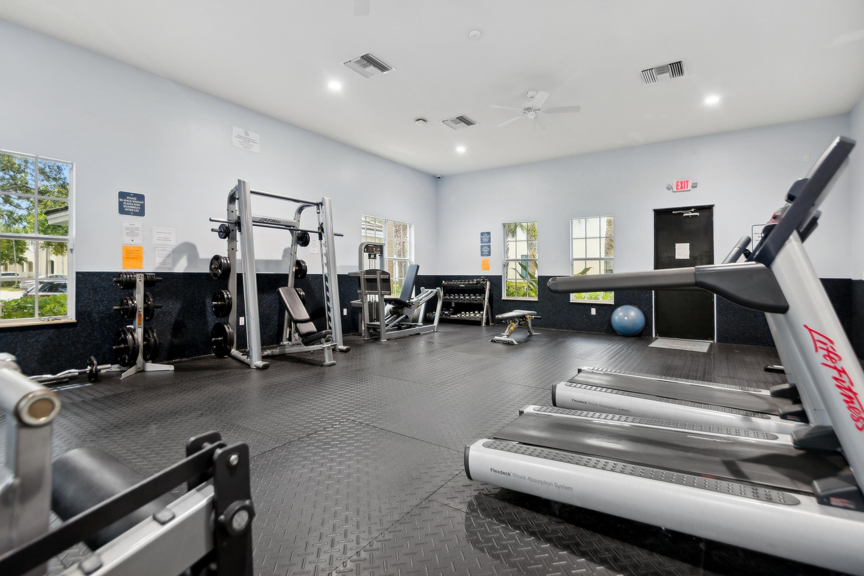 148 Southwest 7th Court Pompano Beach, FL 33060 - Photo 19 of 19 a living room with lots of furniture and a rug