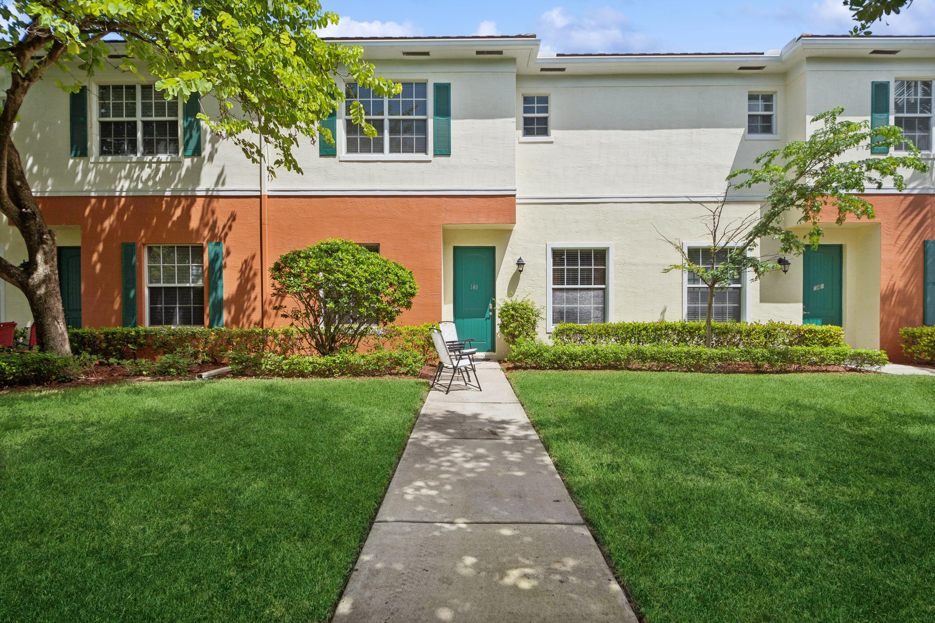 148 Southwest 7th Court Pompano Beach, FL 33060 - Photo 2 of 19 front view of a house and a yard