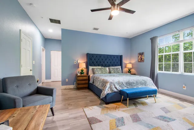 a bedroom with a bed and window