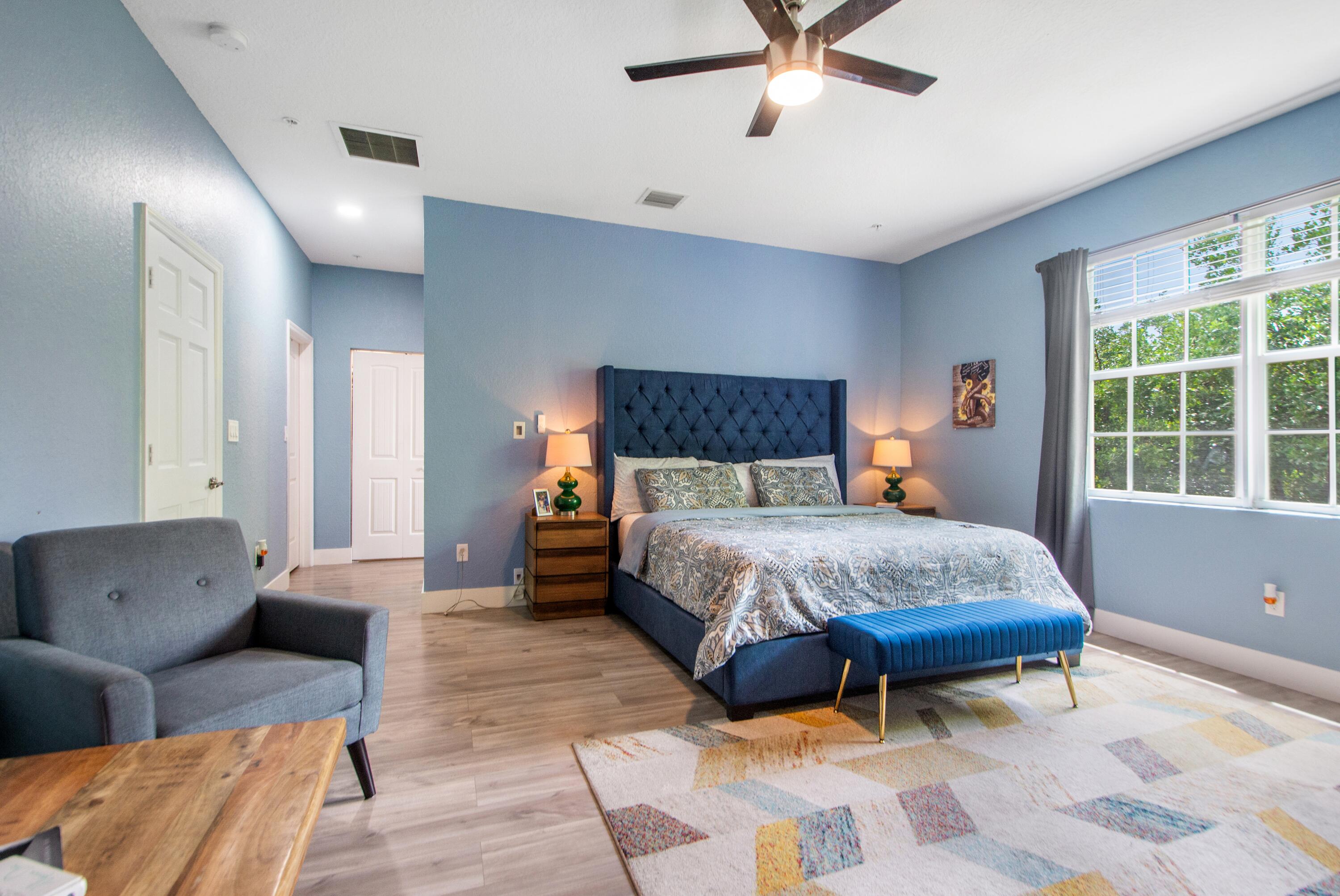 148 Southwest 7th Court Pompano Beach, FL 33060 - Photo 9 of 19 a bedroom with a bed and window