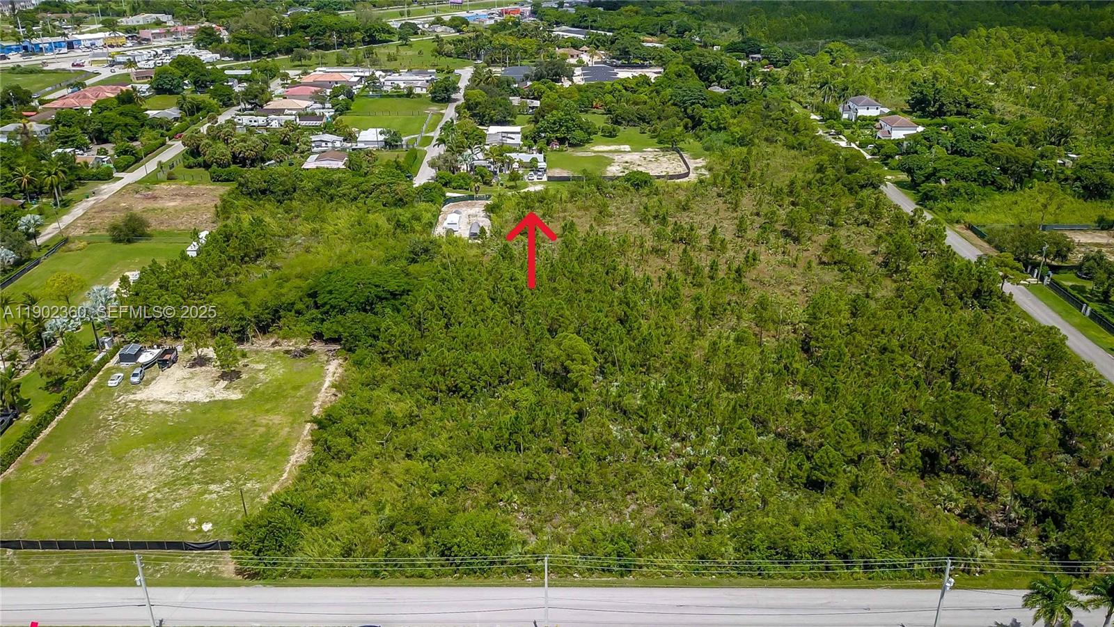 12251 Southwest 230th Street Miami, FL 33170 - Photo 3 of 13 a view of a yard